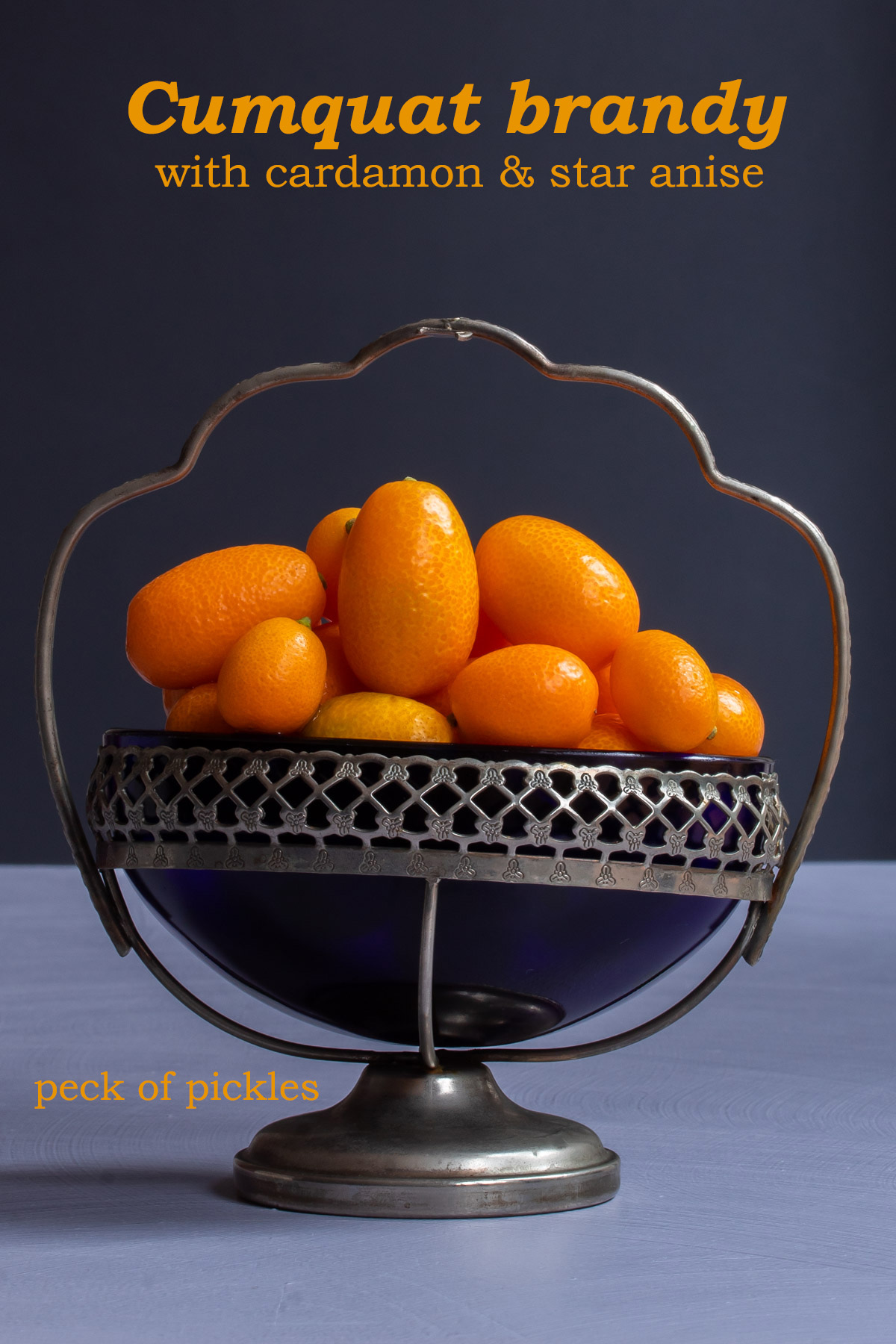 making cumquat brandy with cumquats in vintage glass sugar bowl