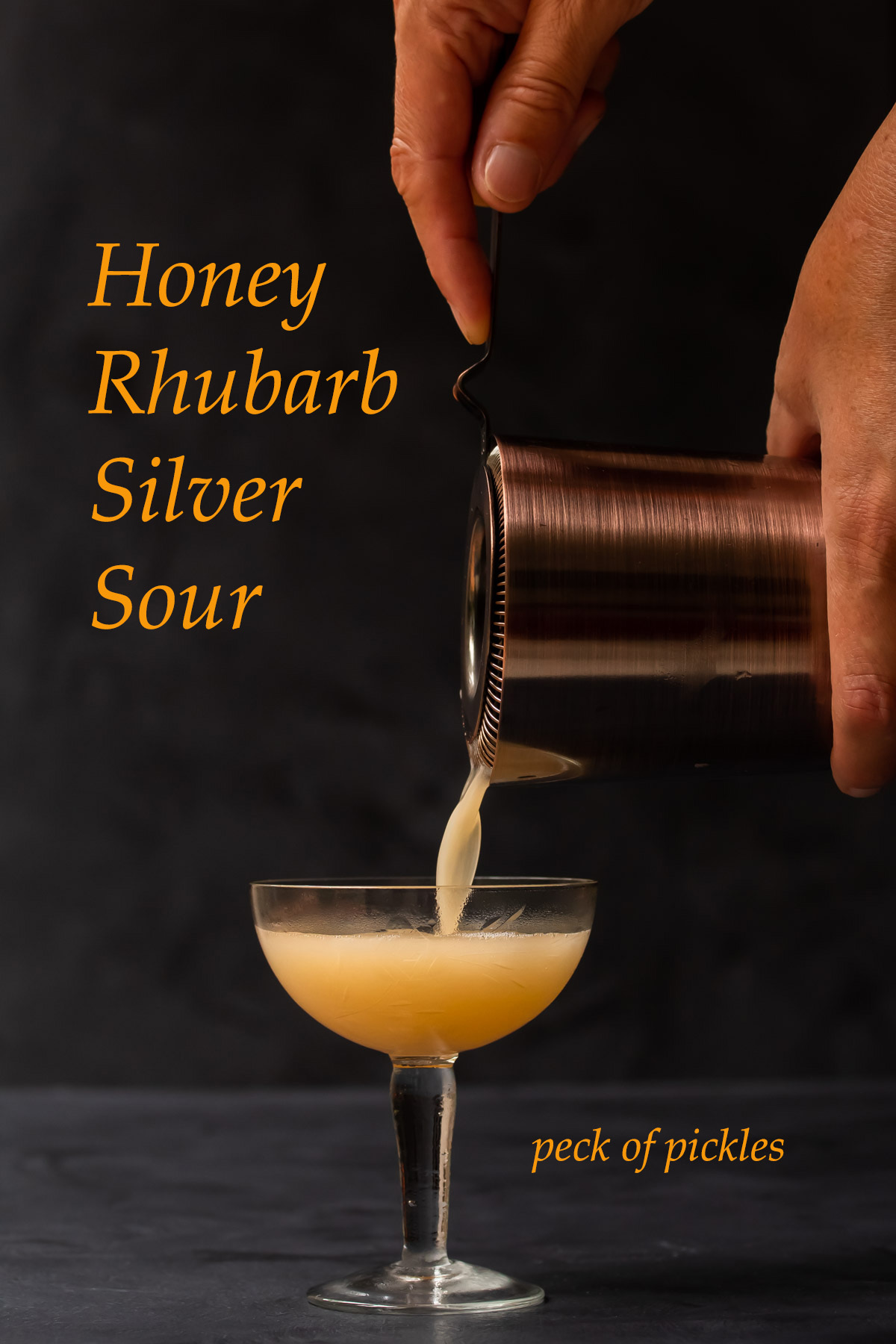 pouring honey rhubarb silver sour glass 2/3 full