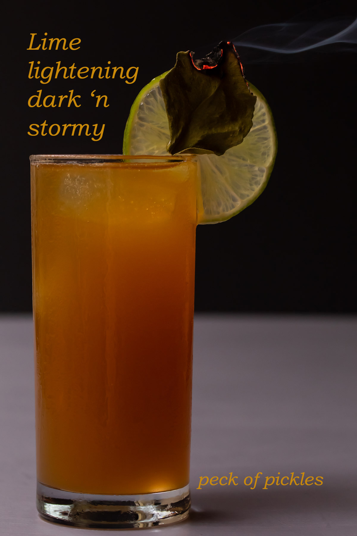 lime lightening dark 'n stormy with smoking kaffir lime leaf garnish