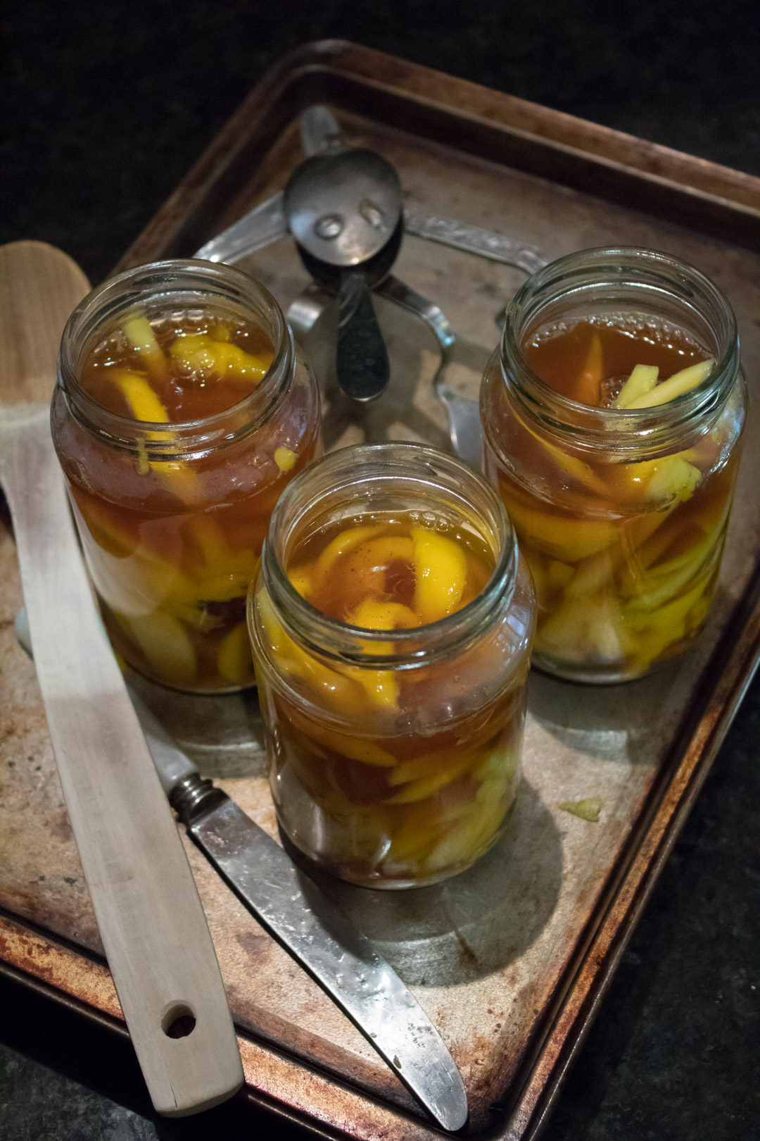 green mango pickle filled jars