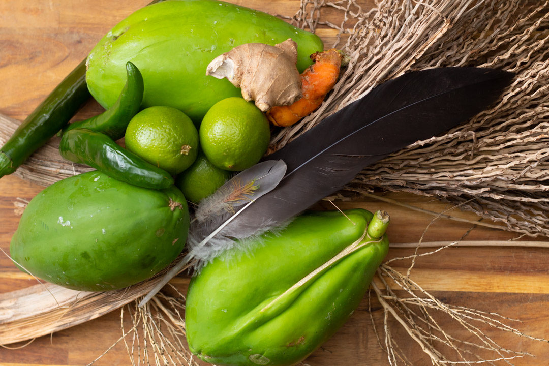 green papayas with lime, chili, ginger, turmeric