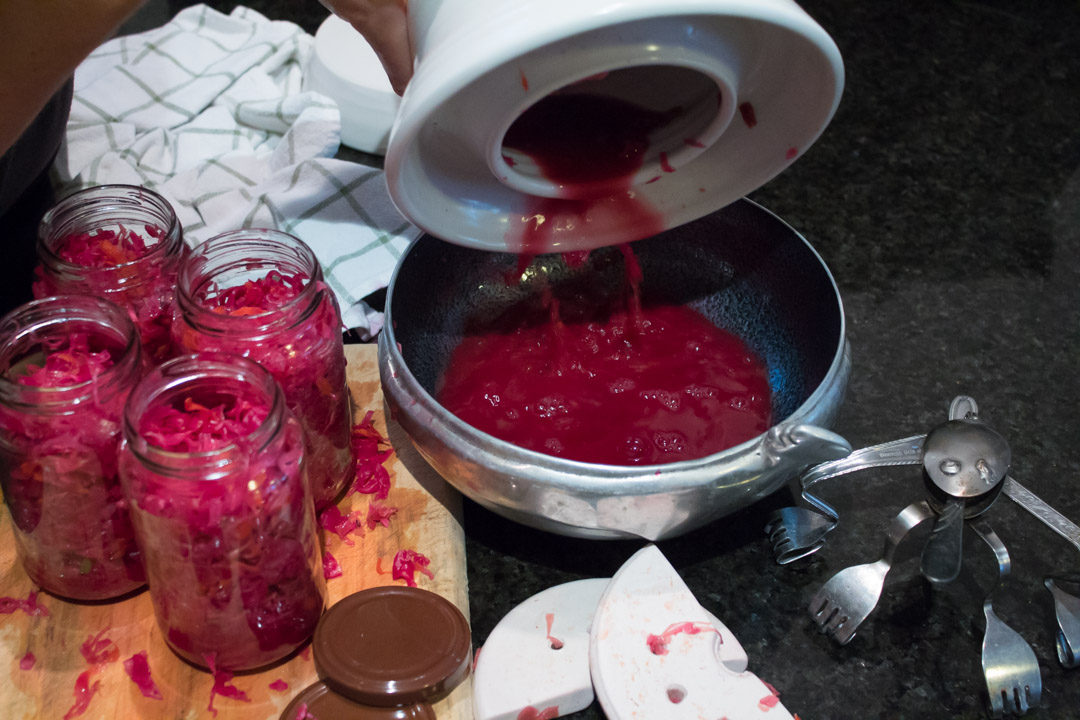 pink-purple sauerkraut decanting frozen pour