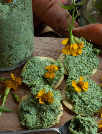 carrot top pesto crackers flat lay