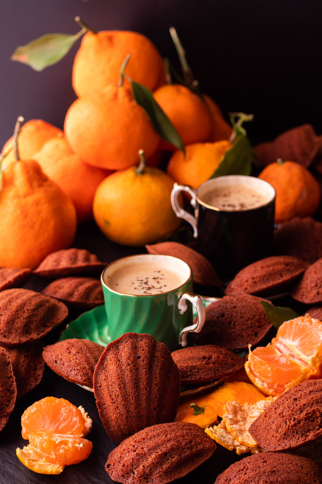 madeleines with mandarin, raw cacao and wattleseed served with wattleseed coffee and fresh mandarins