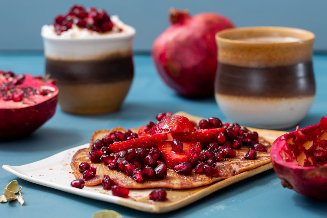 cinnamon, chia buckwheat pancakes with strawberry & pomegranate