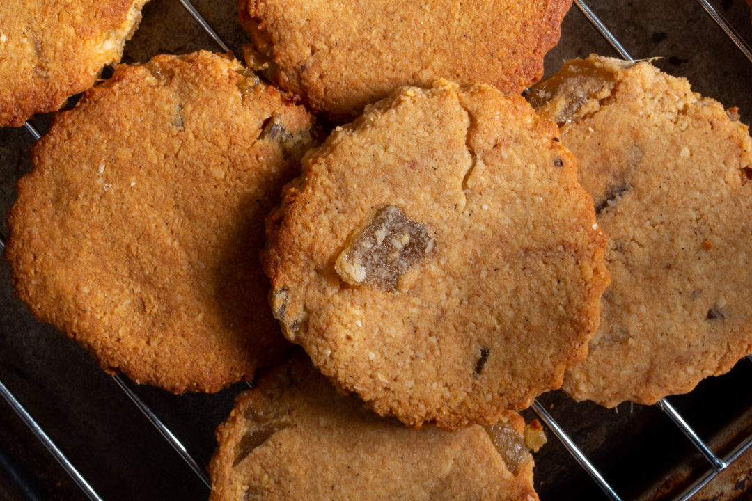 ginger cookies piled on cooling rack