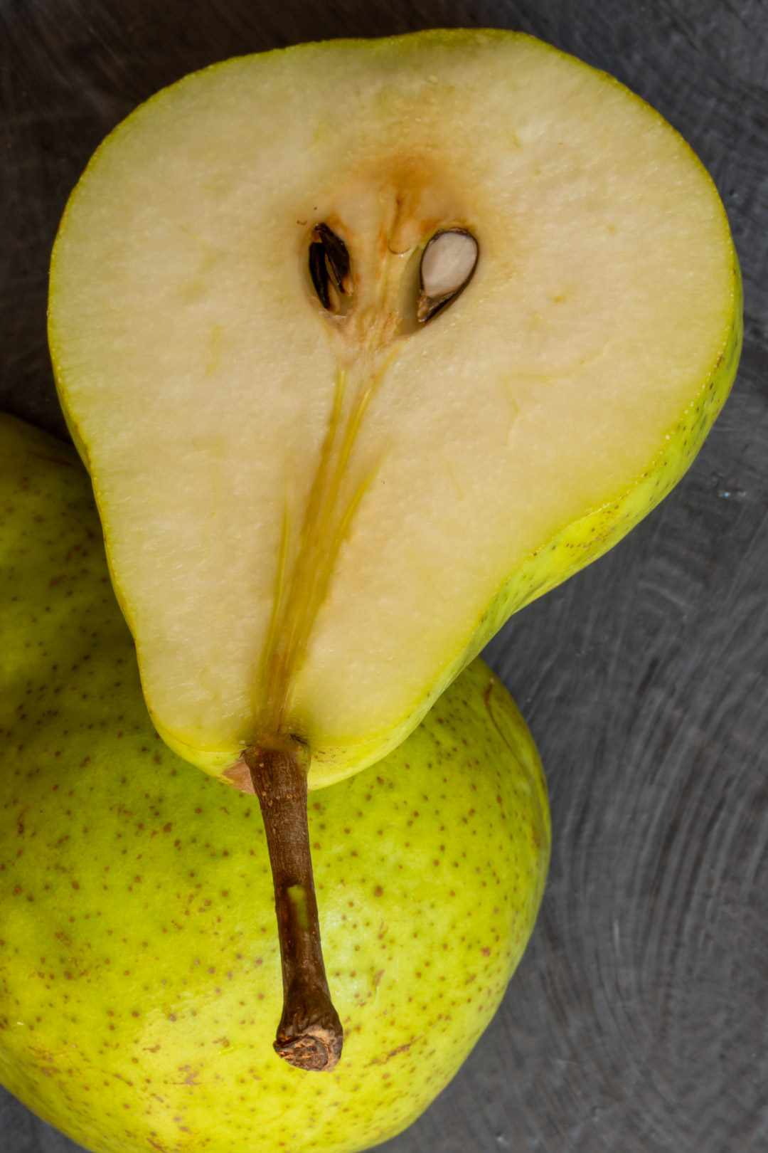 Pear pickles with cardamom & ginger: cut pears inside and outside still life