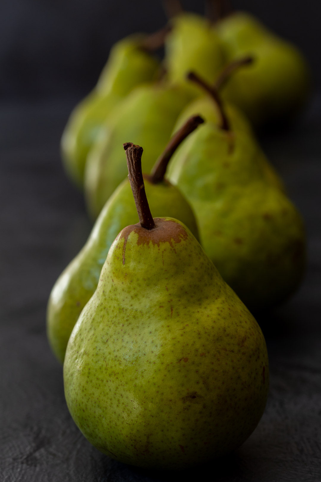 Pear pickles with cardamom & ginger: pears in line still life