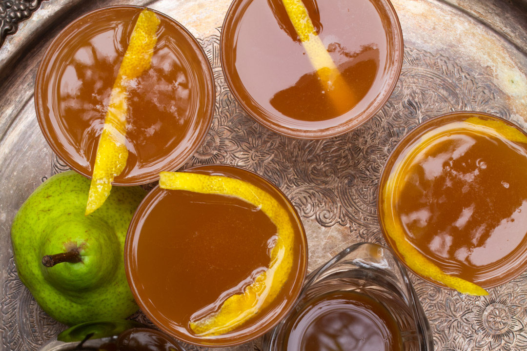 ginger pear champagne cocktail: from above 'with 4 glasses horizontal