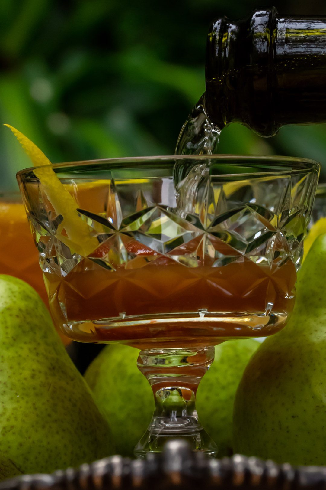 ginger pear champagne cocktail: pouring champagne