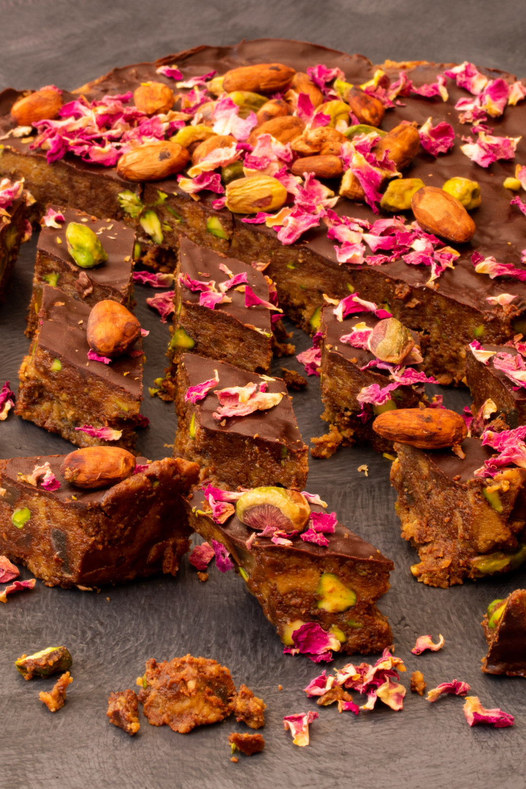 Spiced raw cacao halva with pistachios, ginger, cardamom and rose: cut round