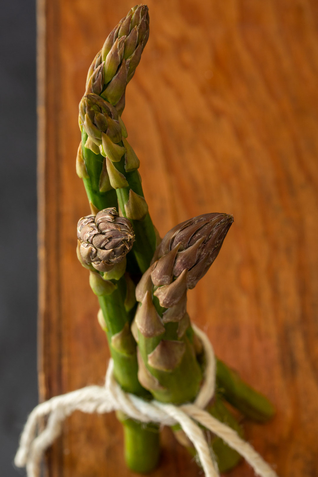 asparagus & lemon tart: asparagus still life on wooden box