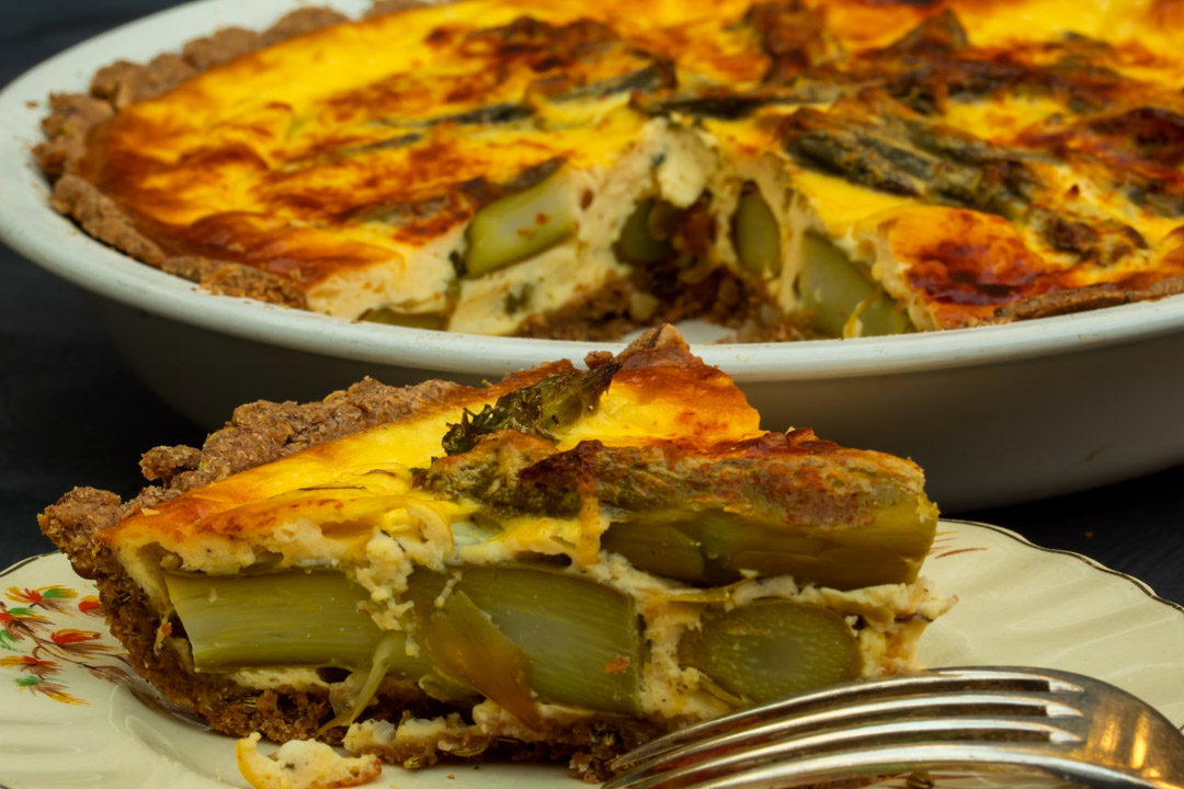 asparagus & lemon tart: slice with whole tart in background