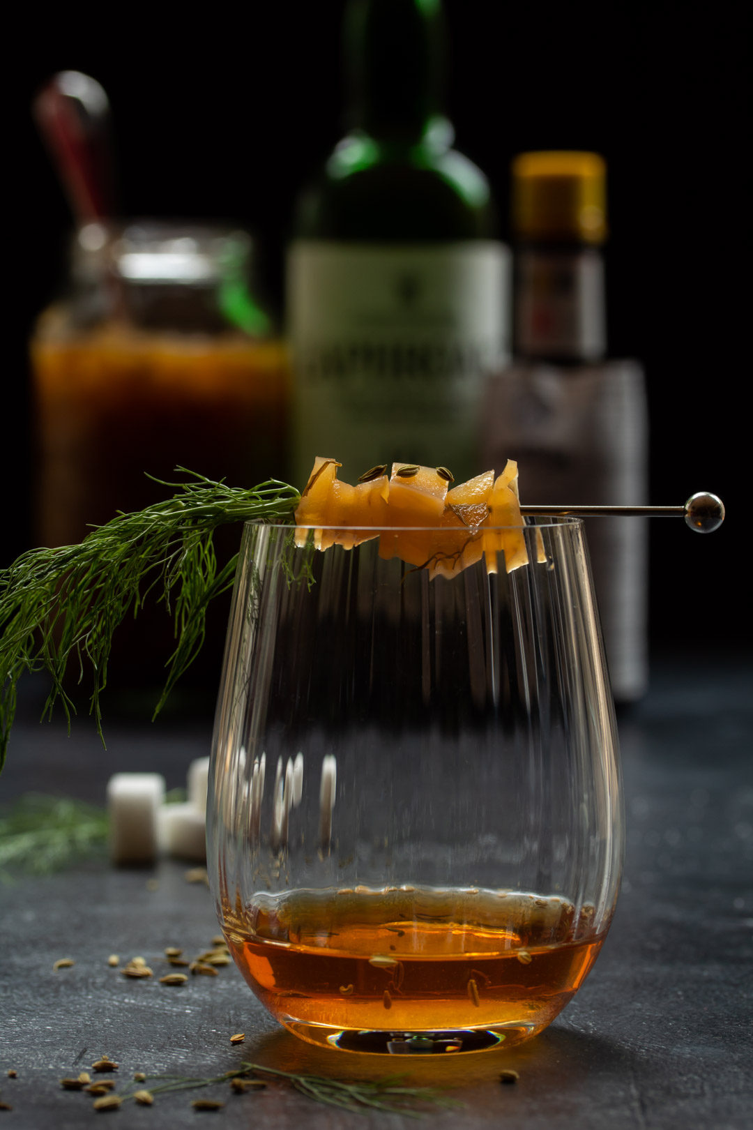 fennel pickle old fashioned cocktail: eye level making vertical