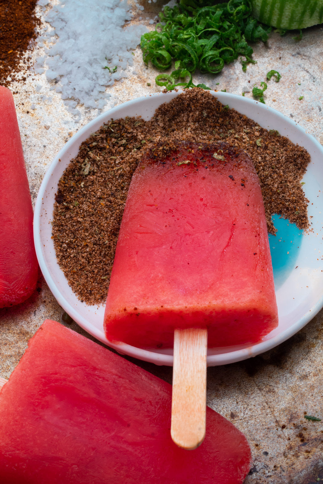 Watermelon paletas with chili-lime salt: from 45 degrees close up