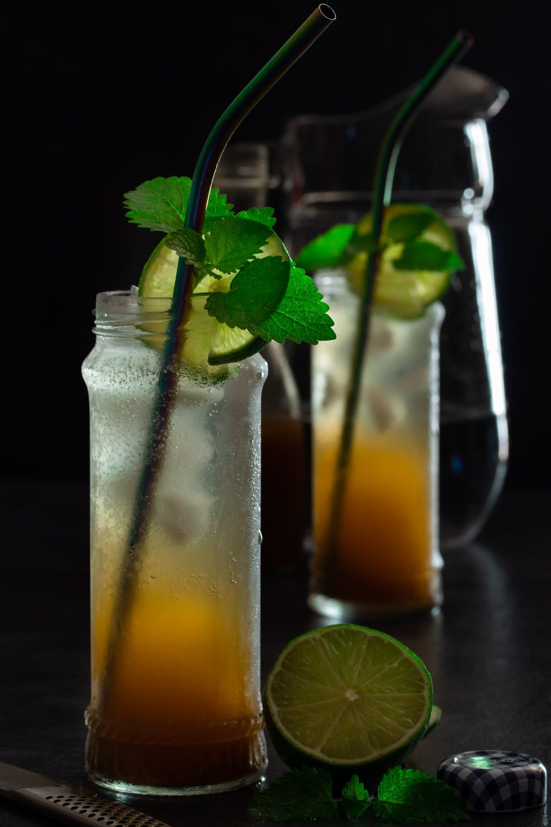 Ginger lime shrub syrup drinking vinegar: jug and bottle in background