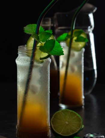 Ginger lime shrub syrup drinking vinegar: jug and bottle in background