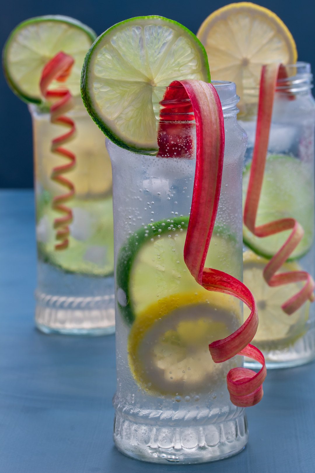 lemon, lime and rhubarb bitters in 3 glasses