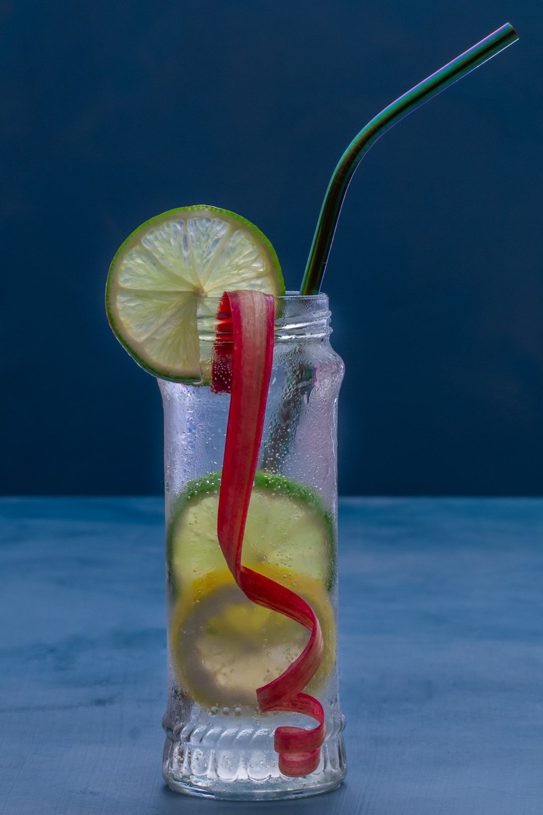 lemon, lime and rhubarb bitters with straw right