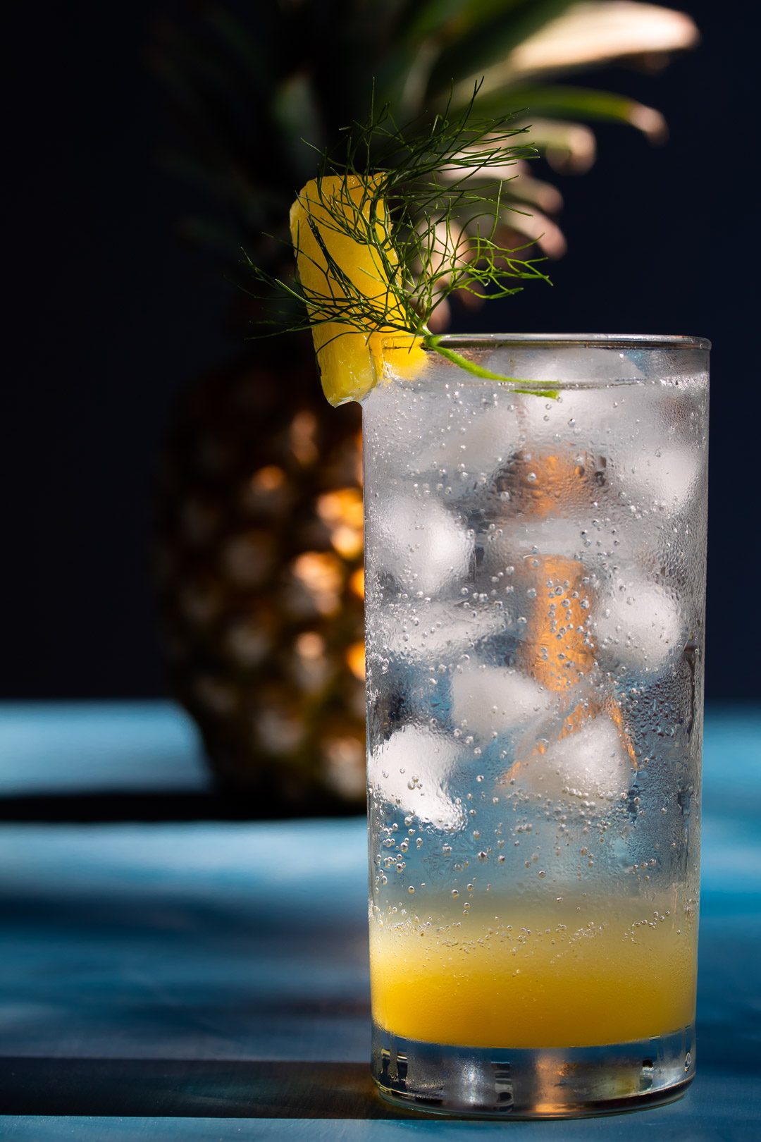 pineapple fennel shrub syrup with pineapple in background