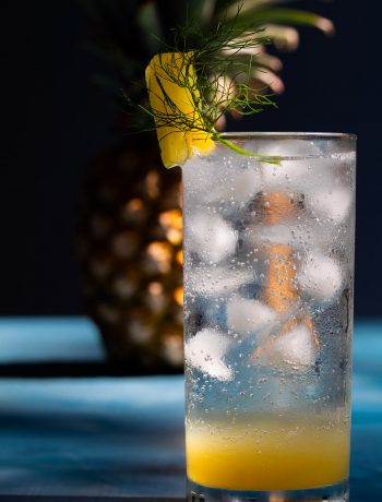 pineapple fennel shrub syrup with pineapple in background