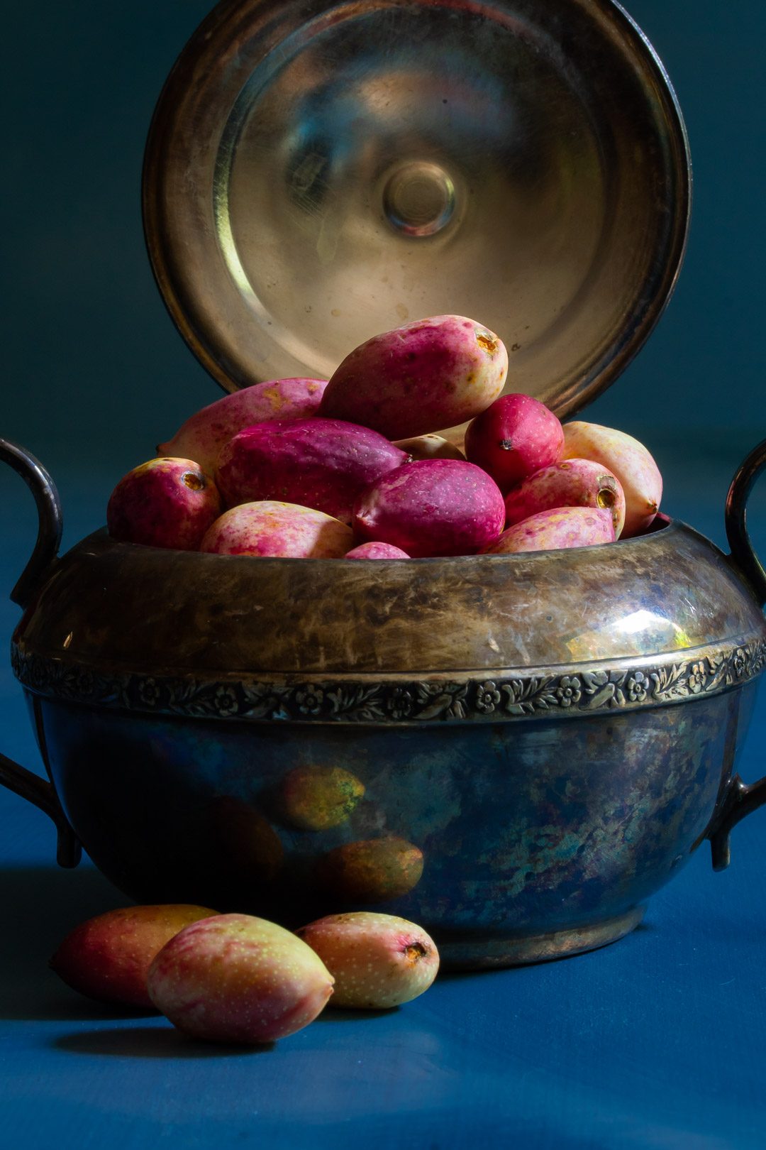 making pistachio rose water orgeat syrup with fresh pistachios in antique sugar bowl