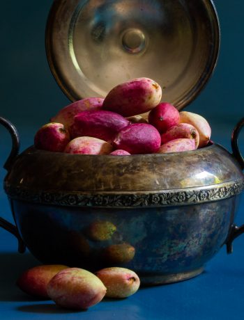 making pistachio rose water orgeat syrup with fresh pistachios in antique sugar bowl