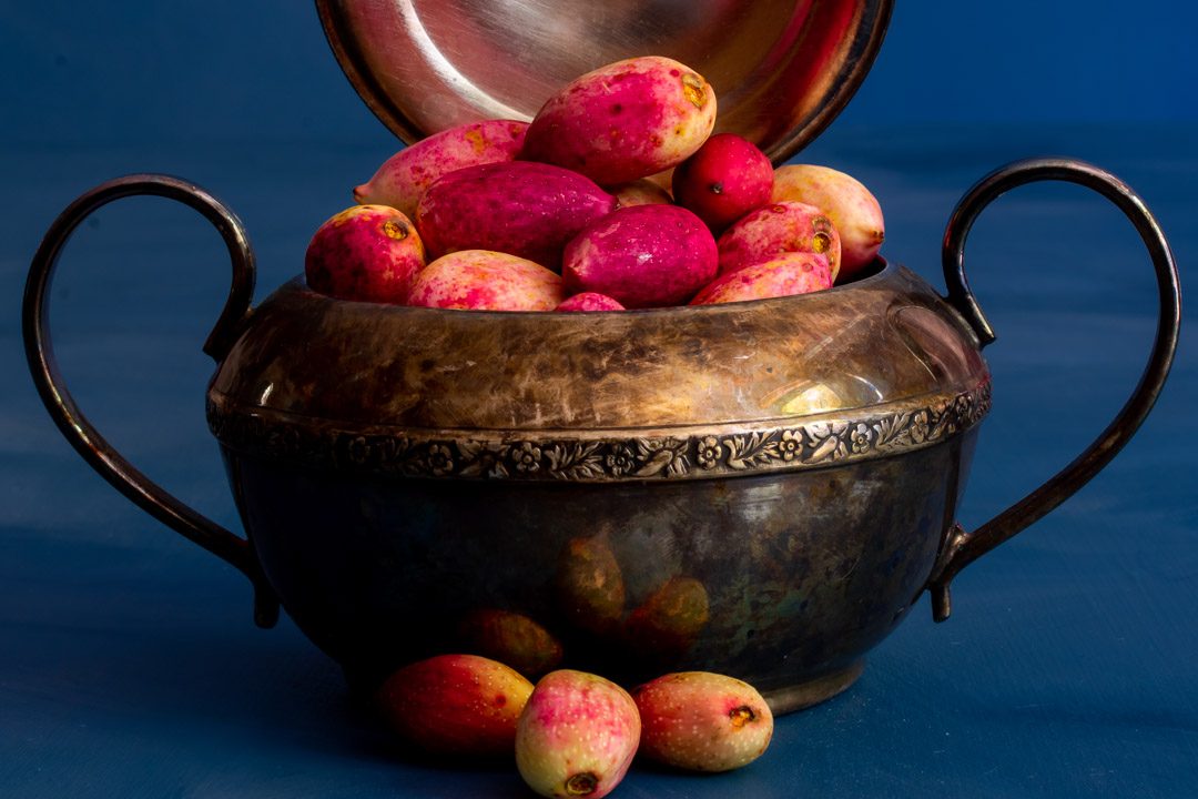 making pistachio rose water orgeat syrup with fresh pistachios in vintage sugar bowl lid open