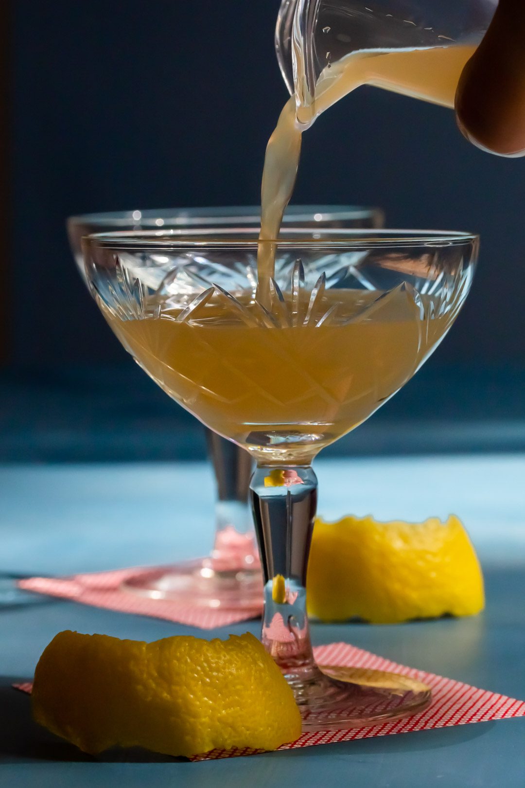 pouring a pistachio rose rhubarb Japanese cocktail