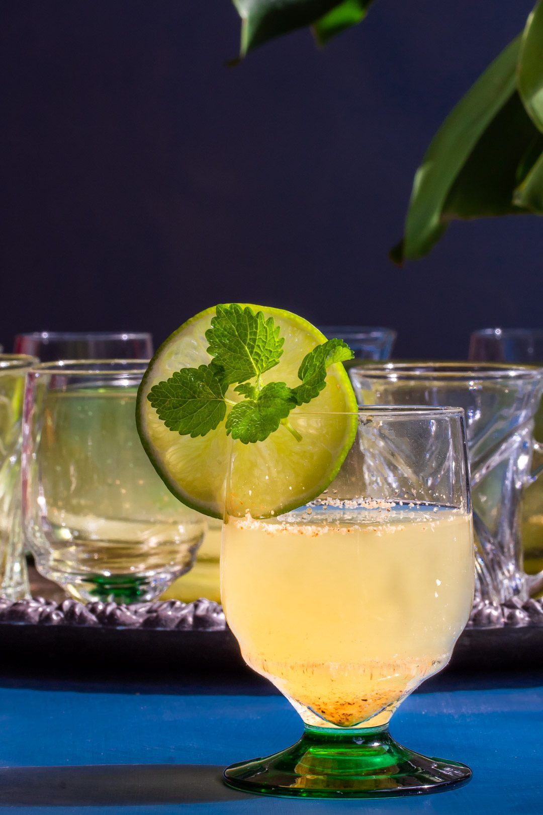 coconut palm arrack punch with glasses in background