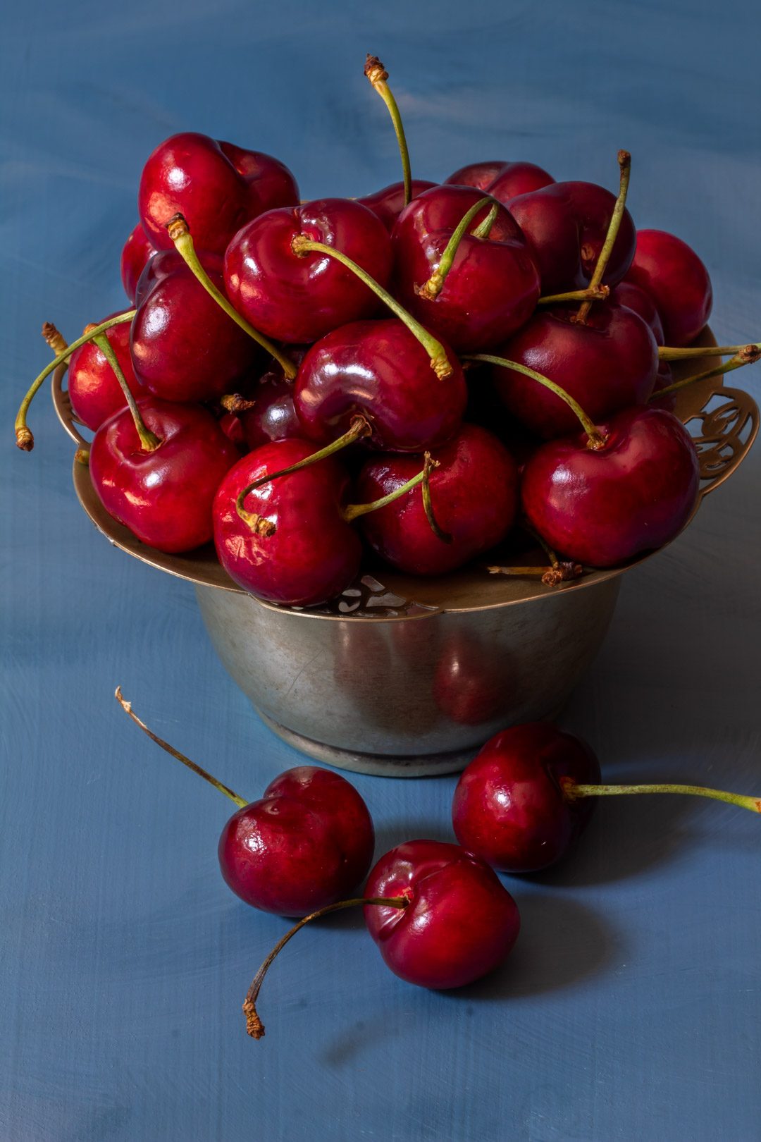 Making spiced pickled cherries with cherries in vintage sugar bowl from 45 degrees