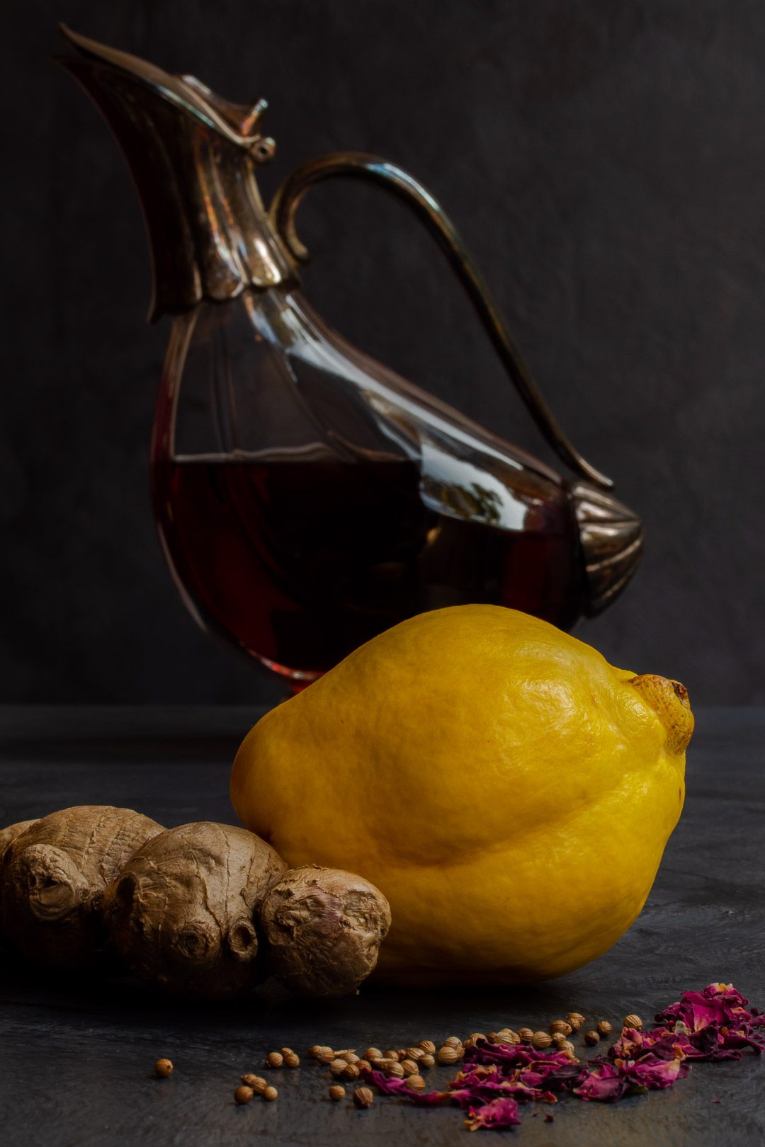 Making Vintage Quince Cordial with ginger, rose, coriander, decanter in background