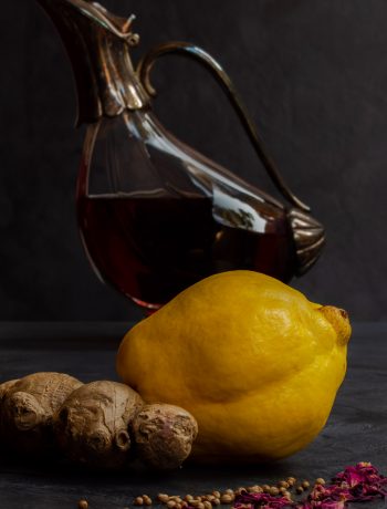 Making Vintage Quince Cordial with ginger, rose, coriander, decanter in background