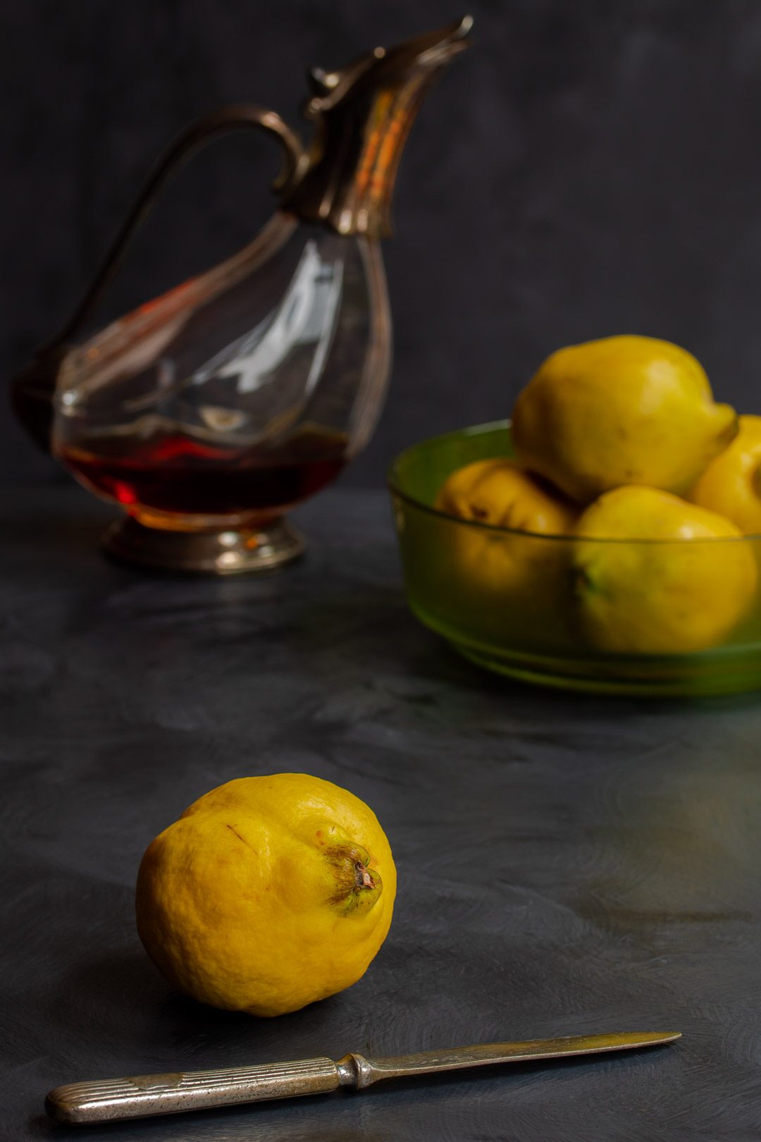 Making Vintage Quince Cordial single quince in foreground