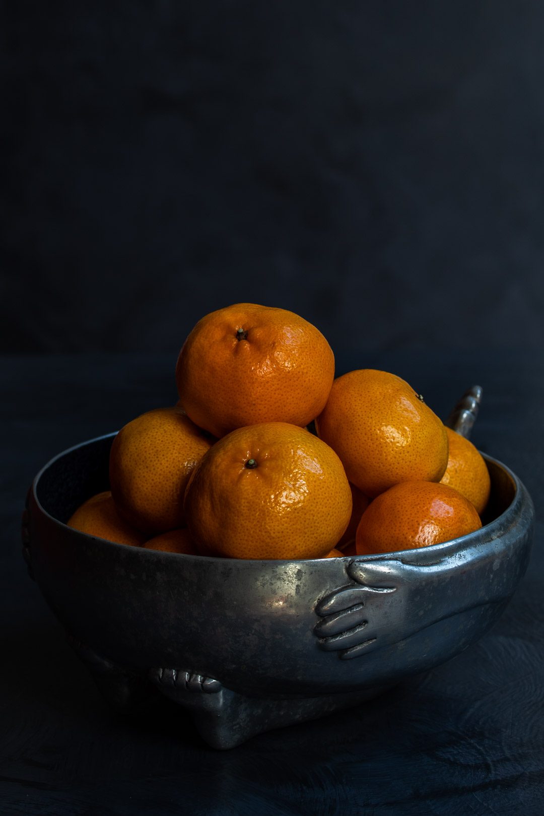 Making Mandarin tarragon shrub syrup drinking vinegar with mandarins in metal bowl