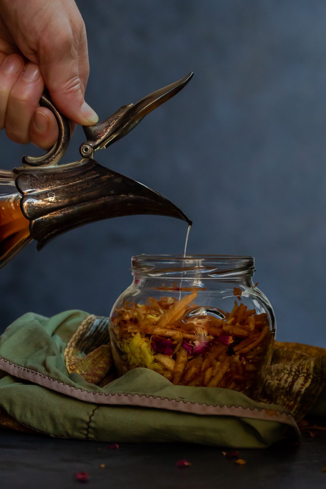 Slowly pouring brandy making Vintage Quince Cordial