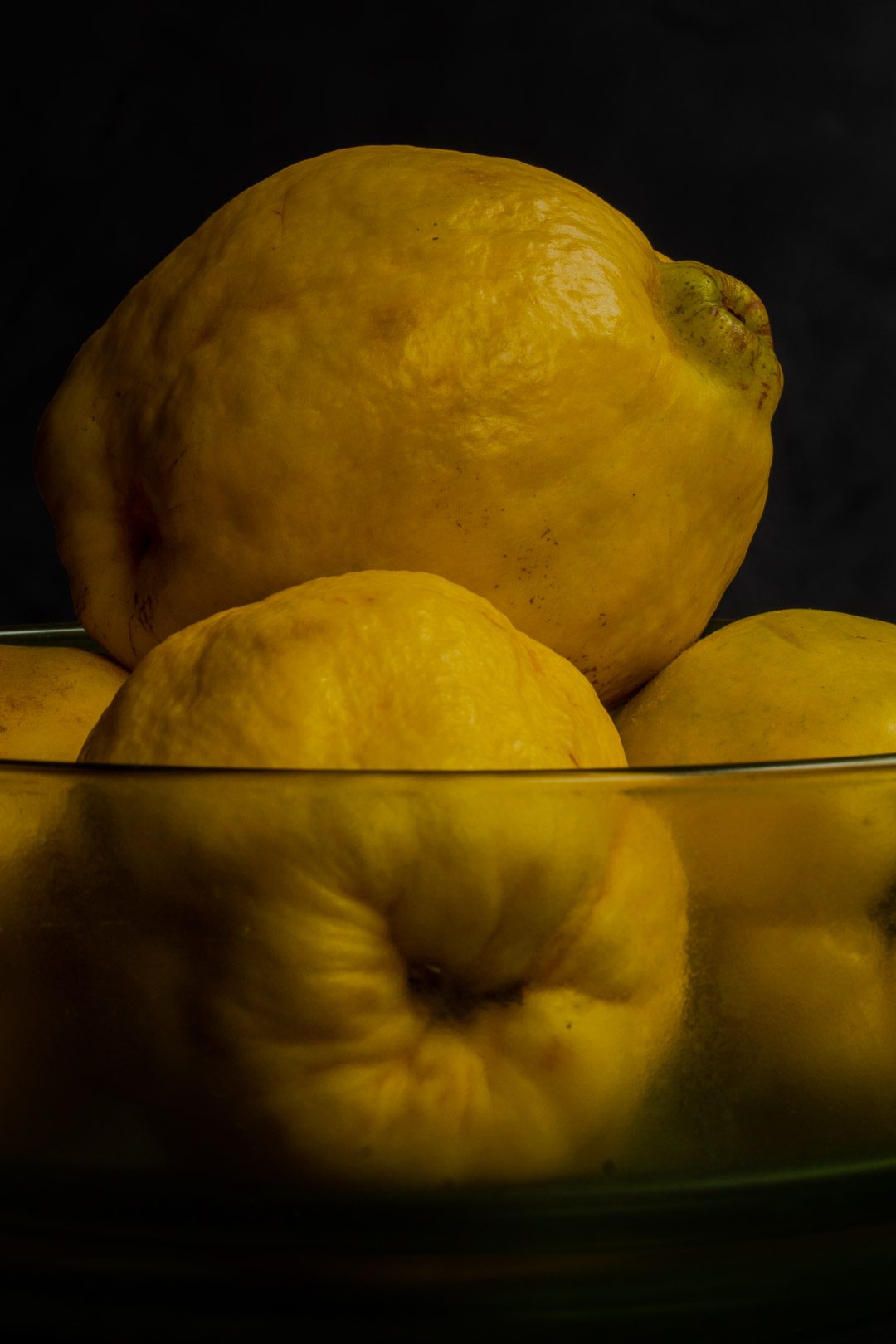 Making Vintage Quince Cordial with quinces in green glass bowl