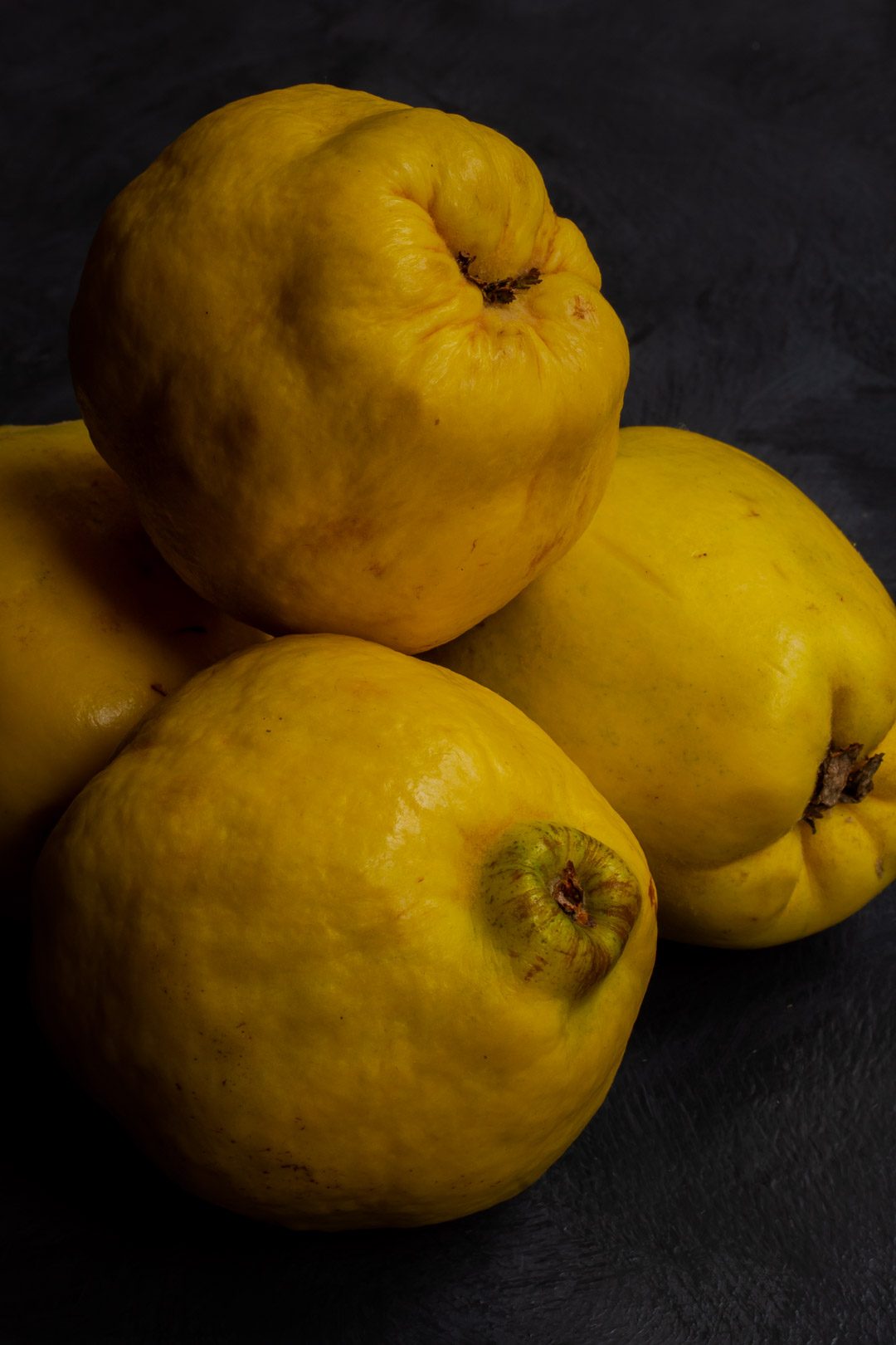 Making Vintage Quince Cordial with quinces in pile from above