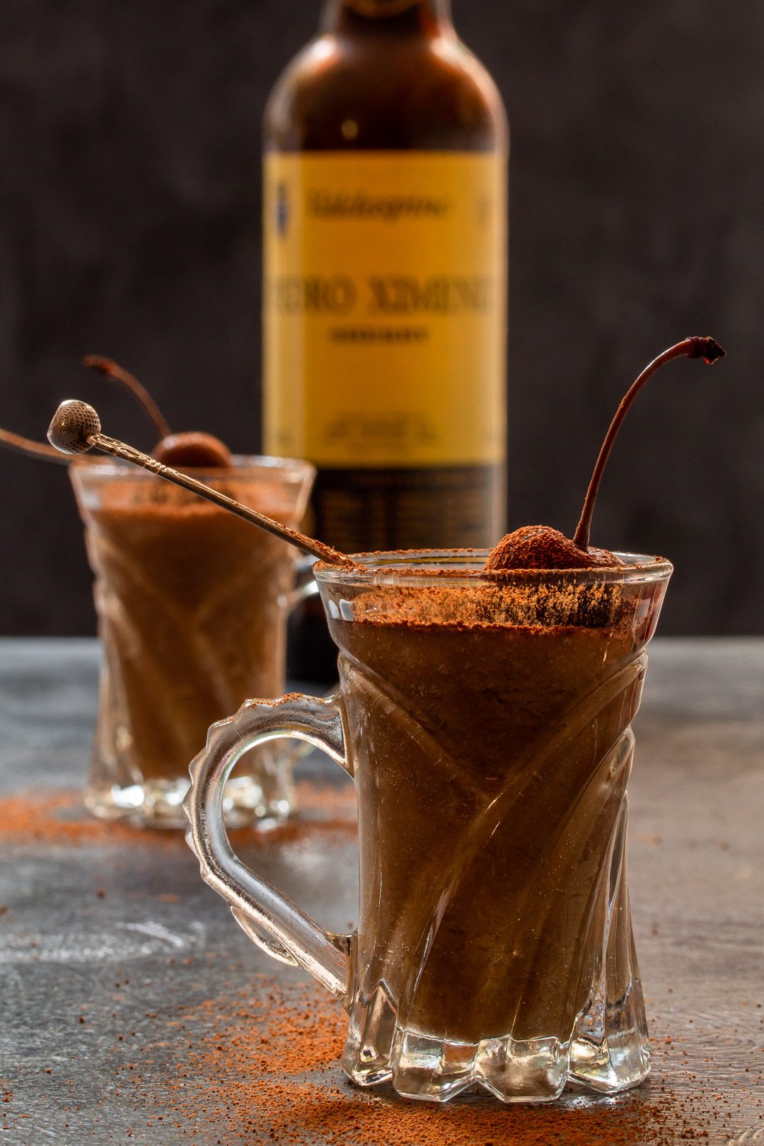 Spiced sherry ‘Sack’ posset with sherry bottle in background