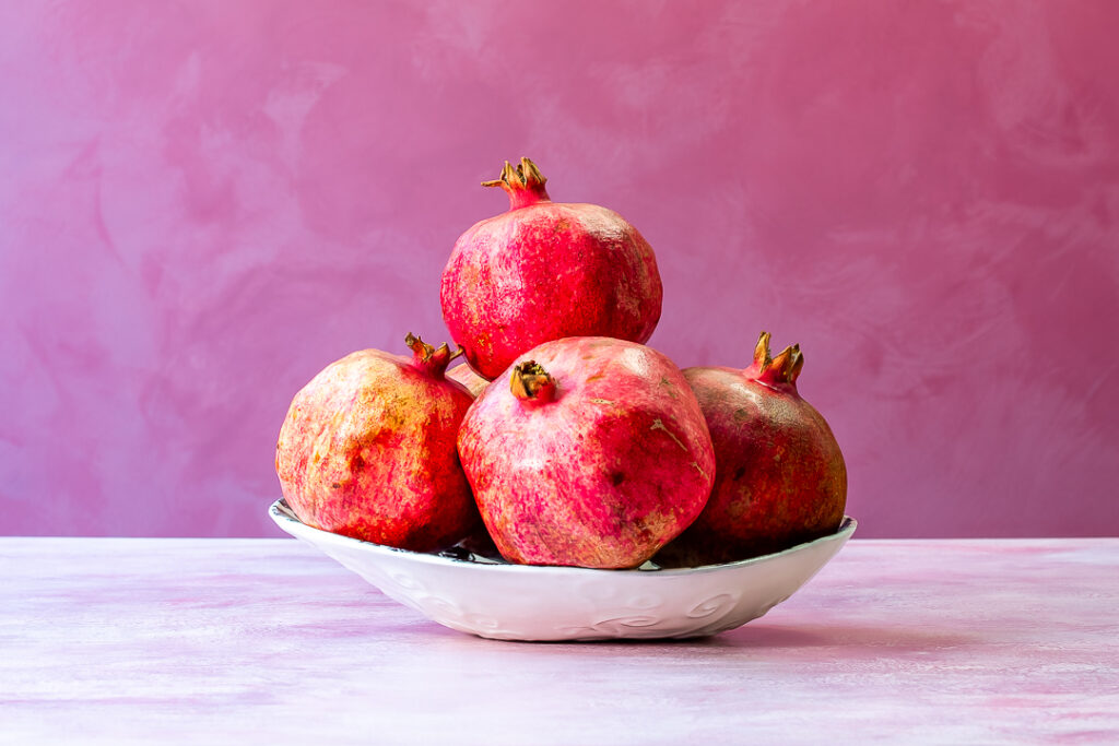 pomegranates in a dish for grenadine horizontal