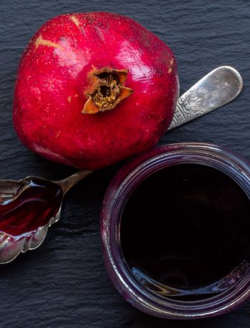 grenadine or pomegranate syrup from above with vintage spoon and pomegranate