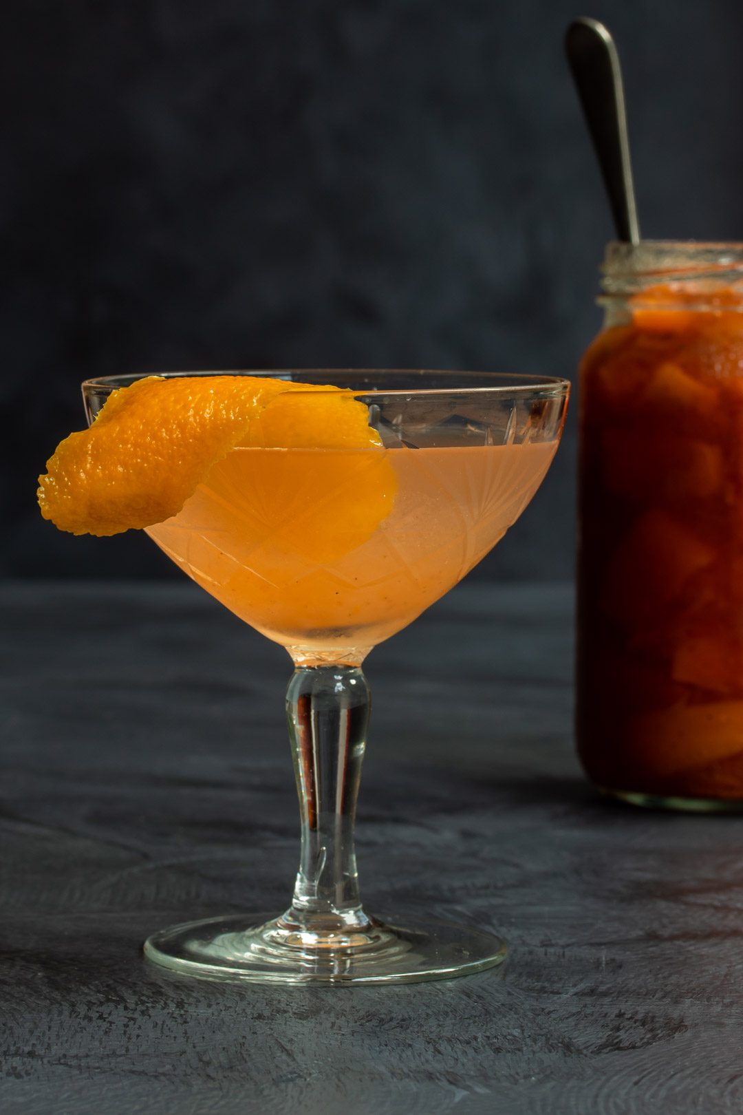 quince apple jam gin sour cocktail with jam jar in background