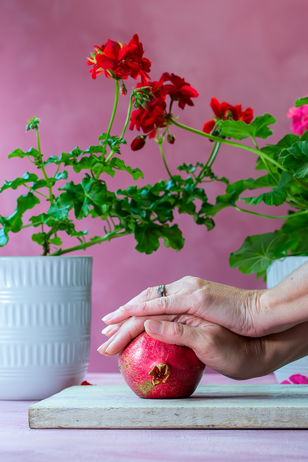 rolling a pomegranate for grenadine