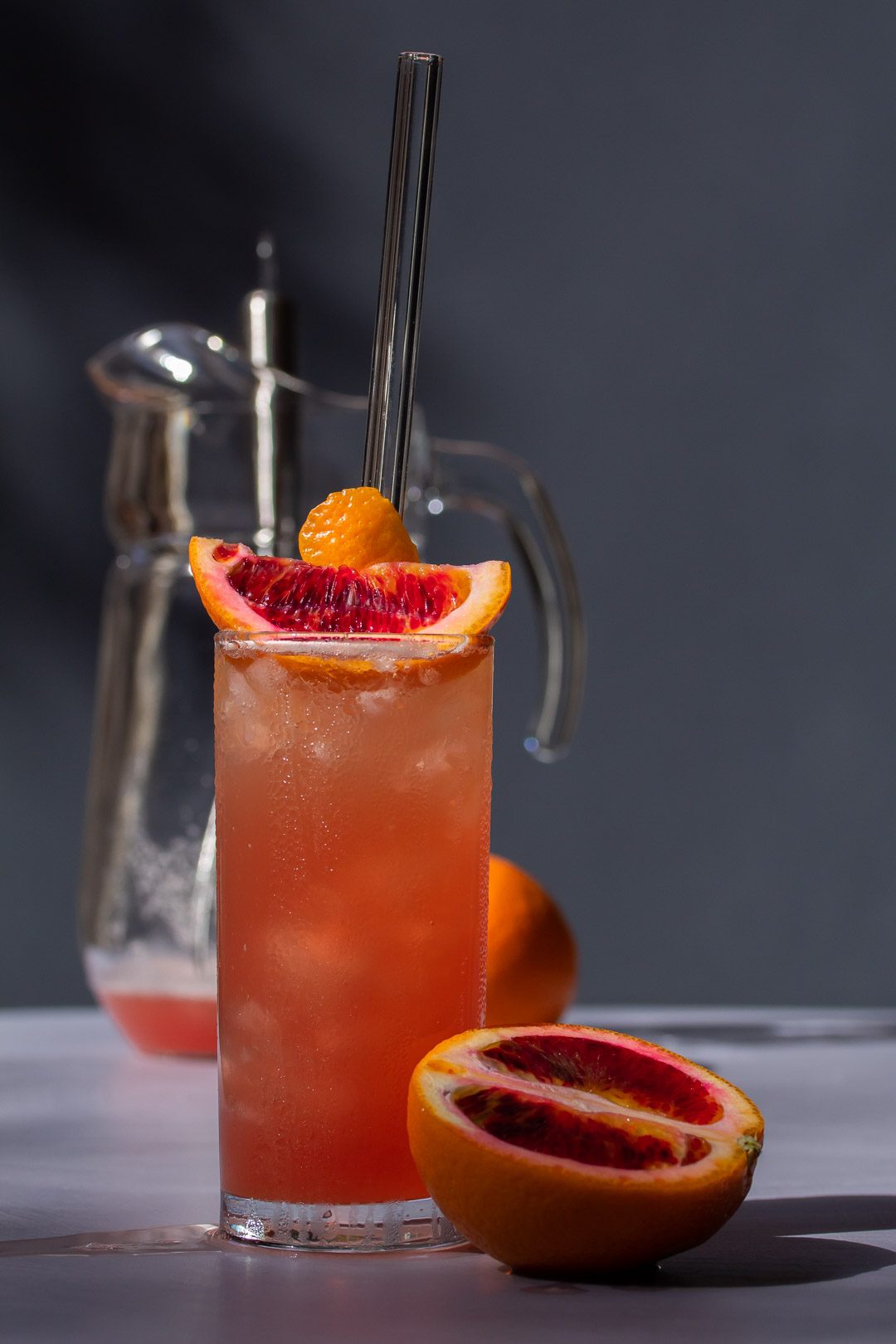 improved blood orangeade with jug and whisk in background