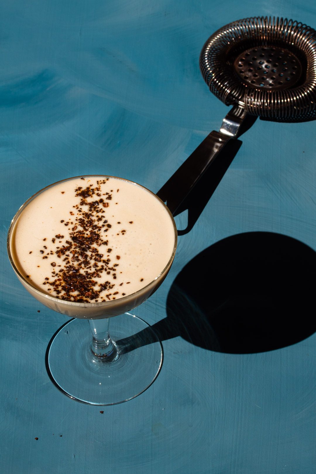 Quince Wattleseed Alexander Cocktail with strainer