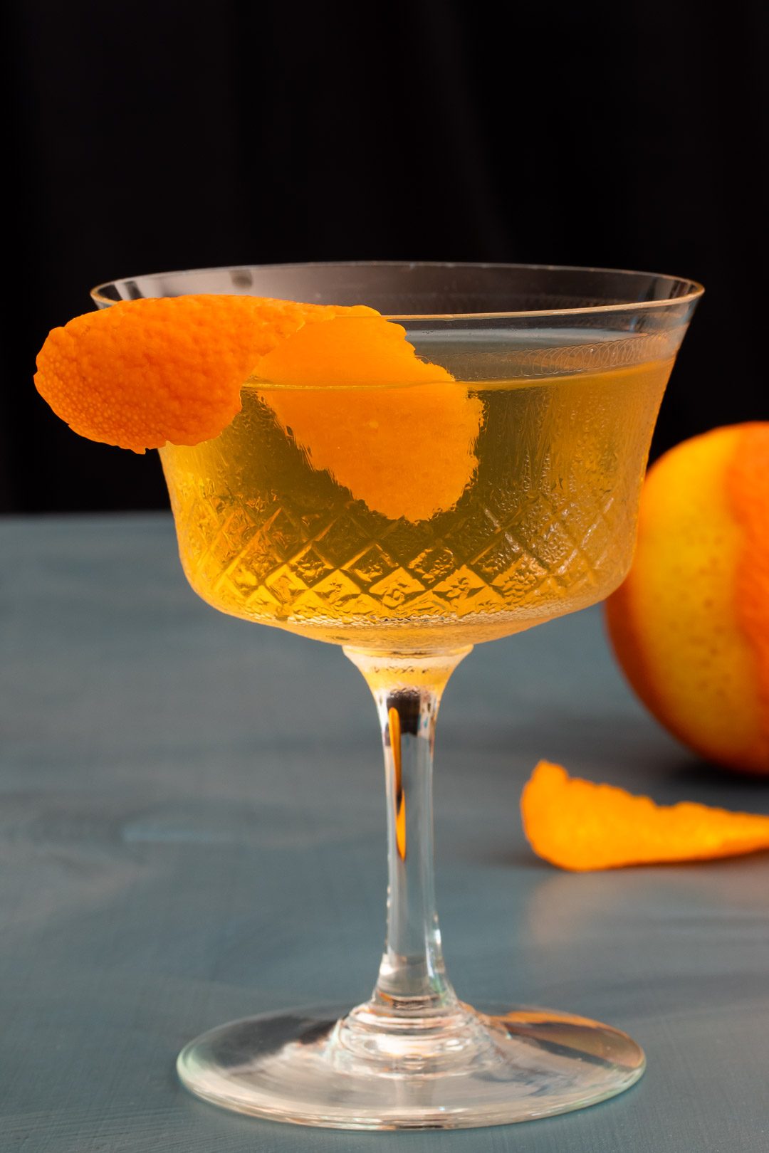 rose lavender dry martini with blood orange in background