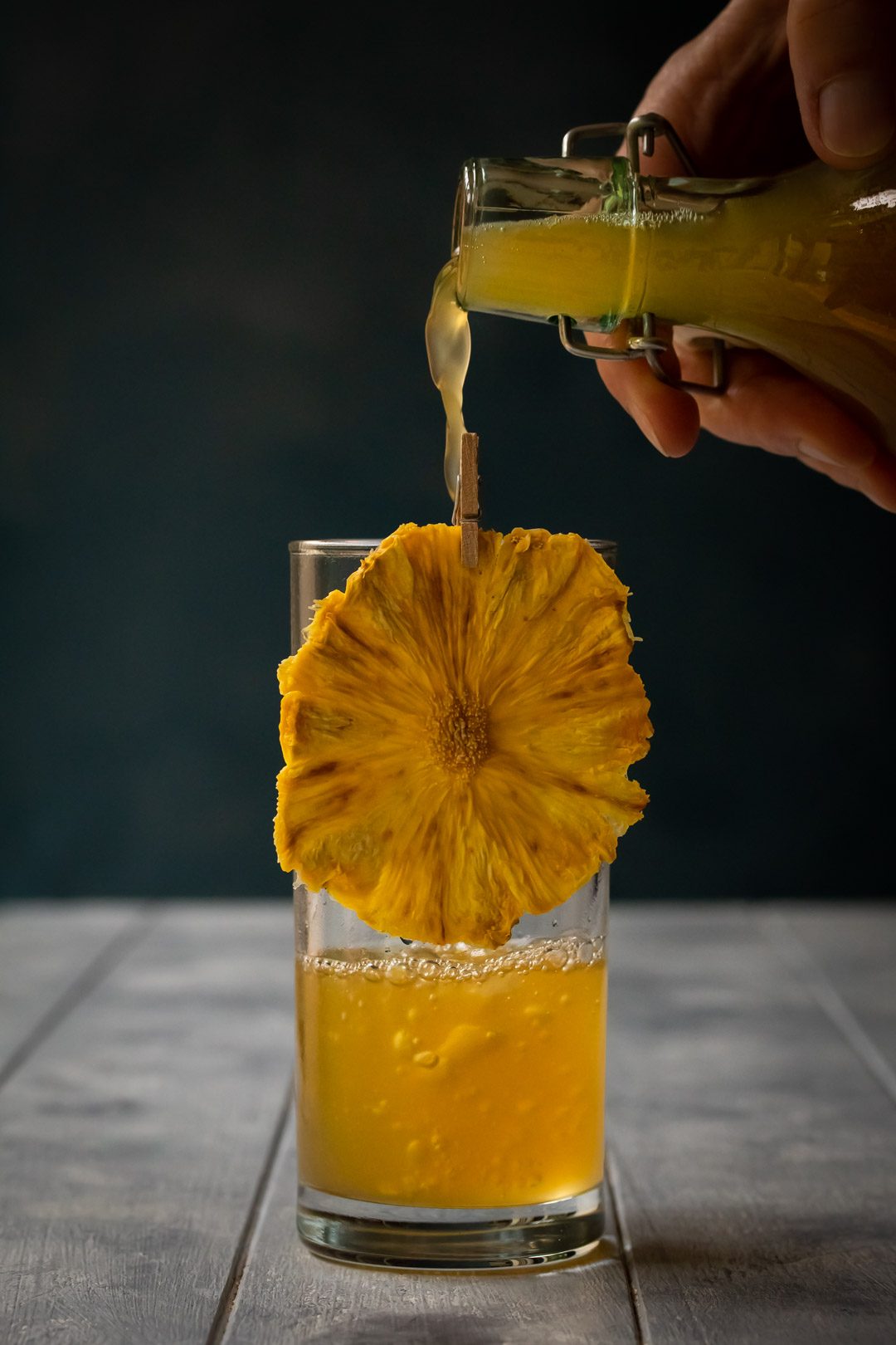 pouring pineapple soda with bubbles for pineapple fiz