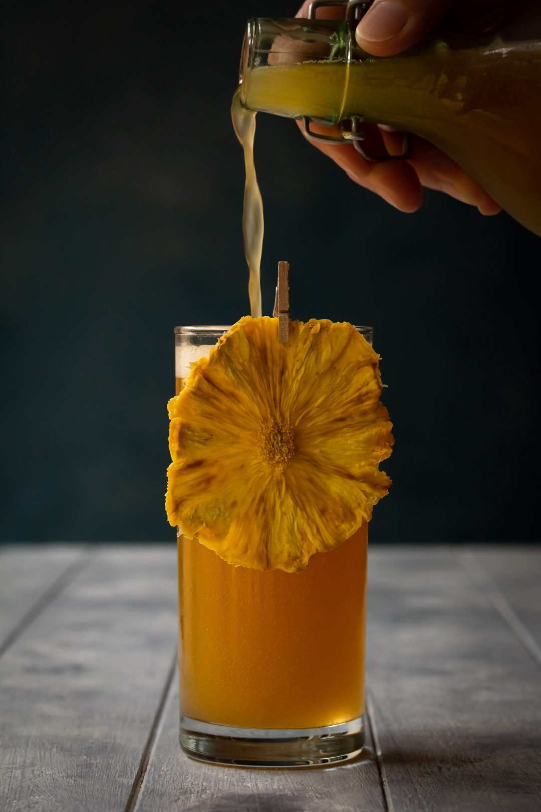 pouring pineapple soda with fizzy top for pineapple fiz