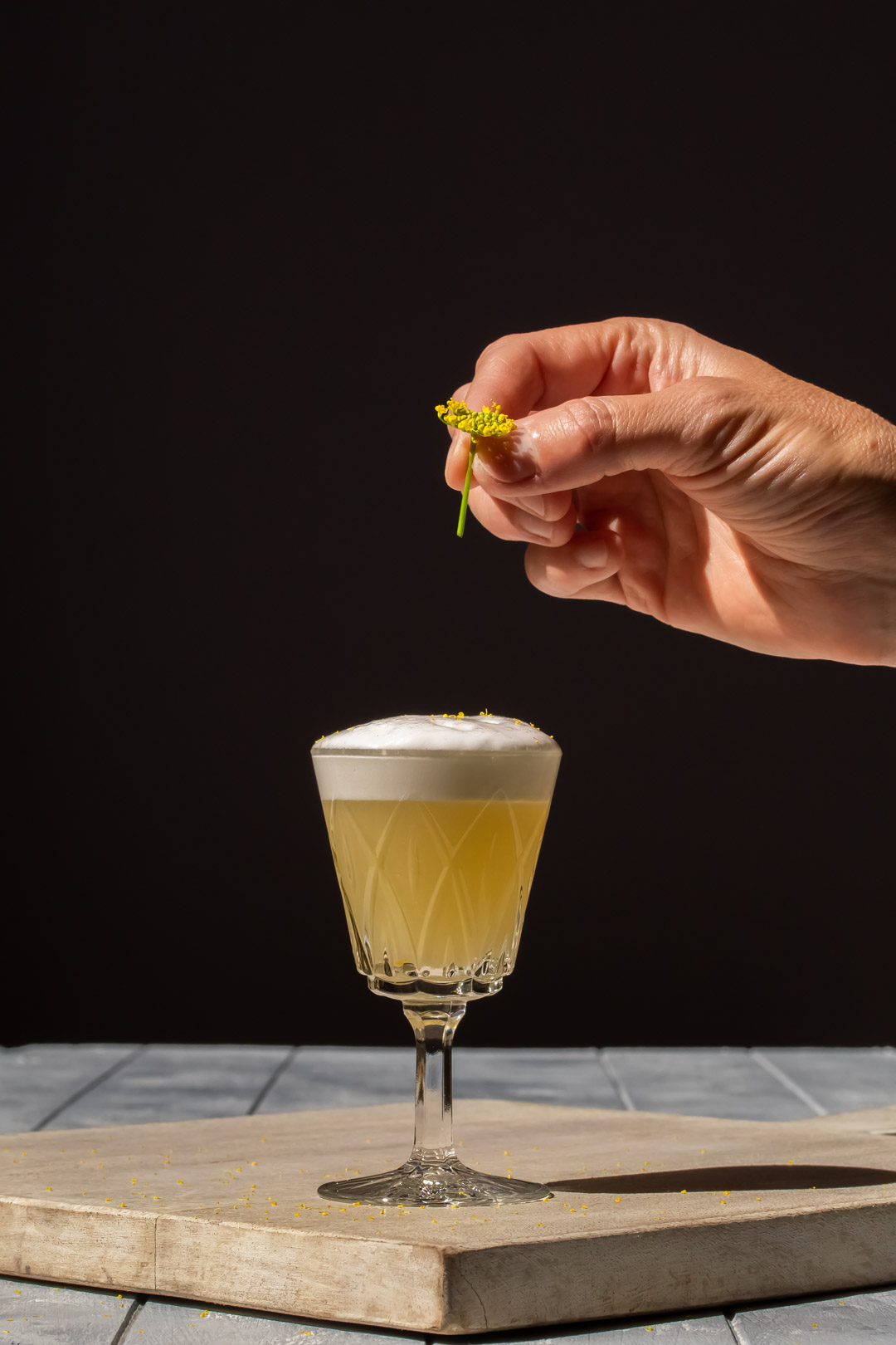 begin garnishing fennel flower silver sour with fennel flower