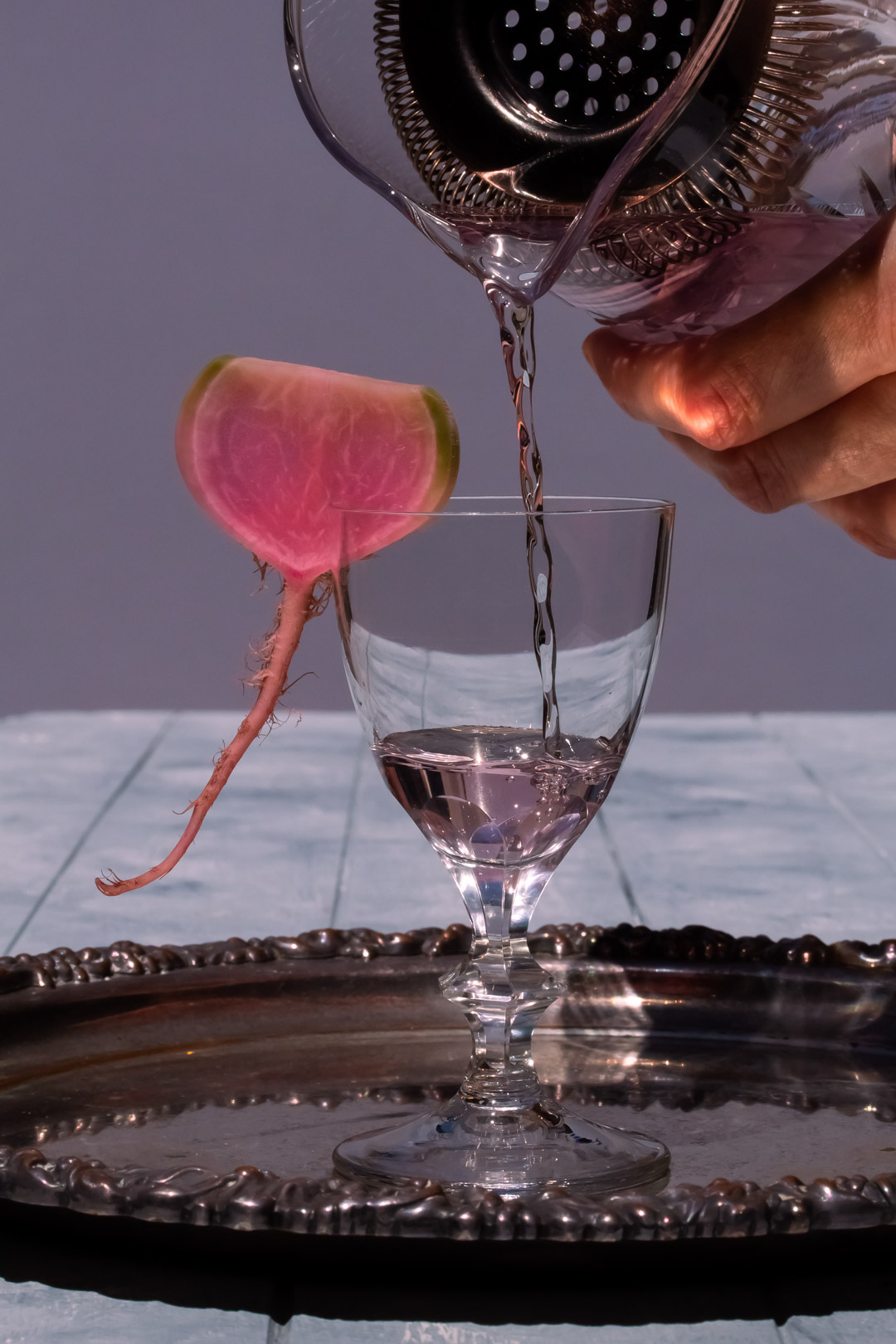 begin pouring fermented watermelon radish martini